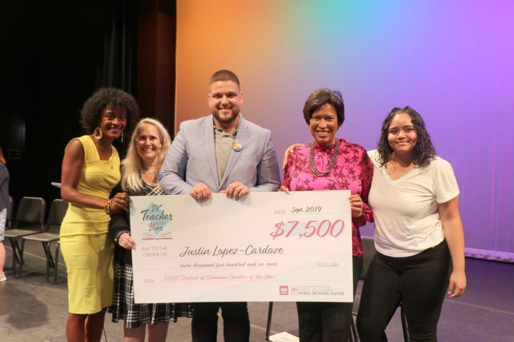 Justin Lopez-Cardoze and Mayor Bowser with Teacher of the Year award